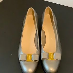 Pewter Salvatore Ferragamo low healed dress shoes with the classic bow & buckle.